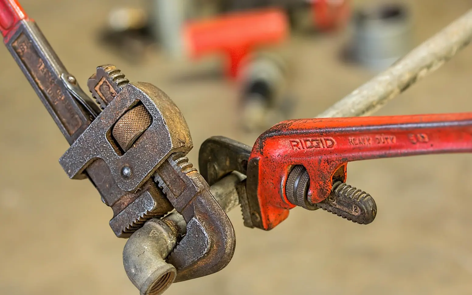 Plumbing, pipe wrench and repair
